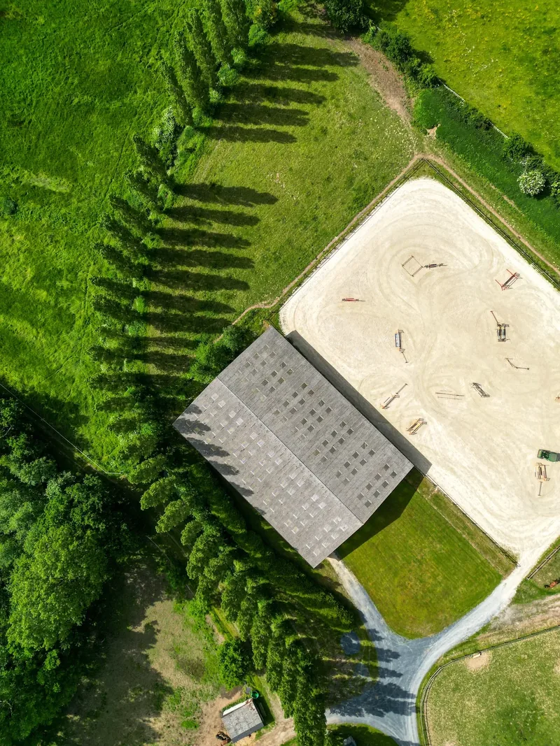 Aerial view of the arenas and poplar-lined pastures at Écurie de Beauclerc