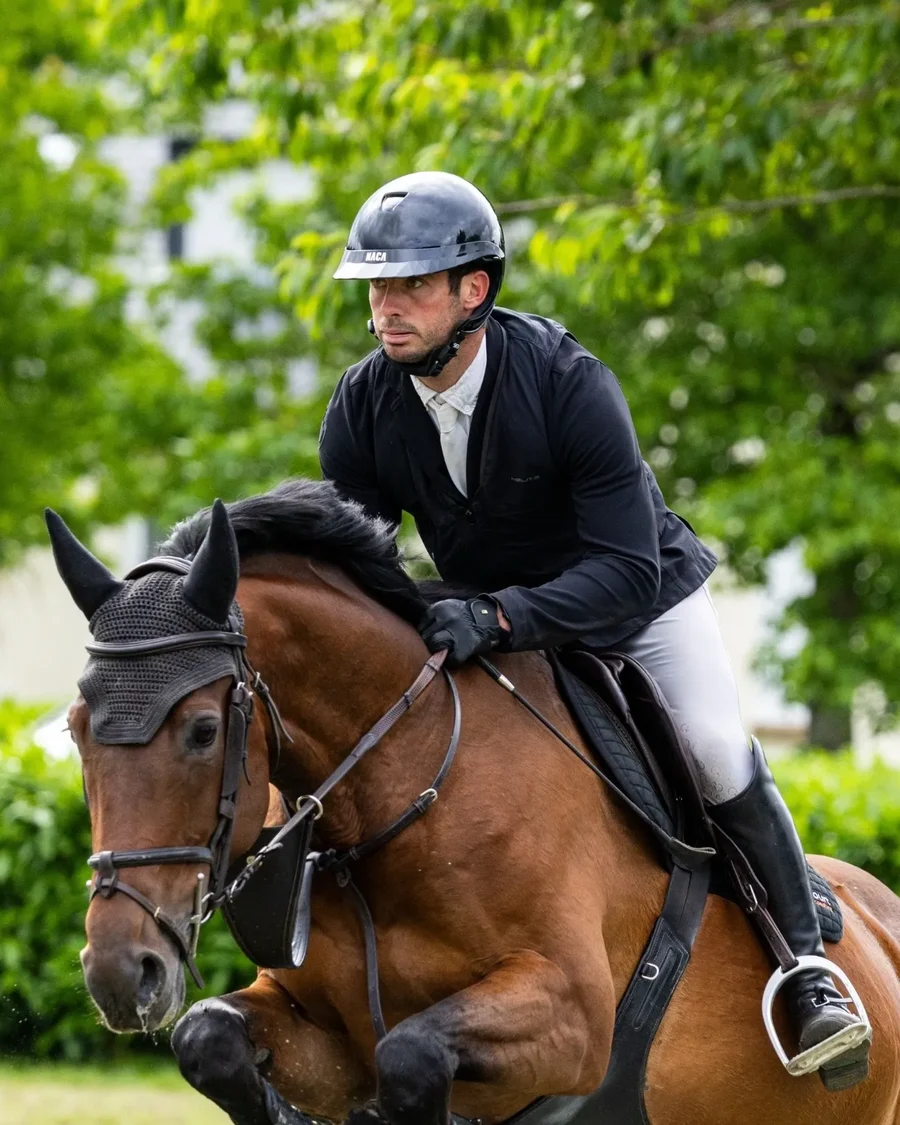 Julien Fremicourt riding a young showjumper over a fence